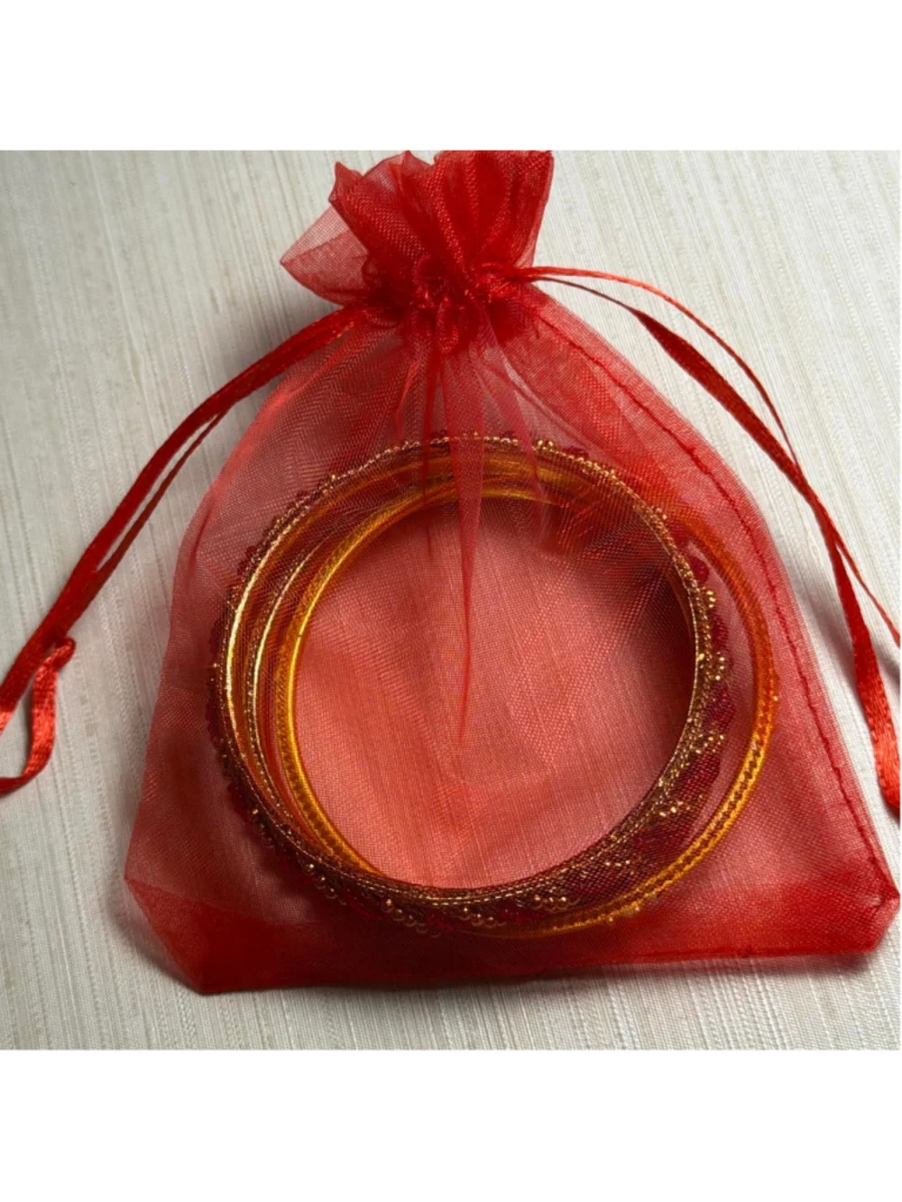 Red and gold children's bangles set with rhinestones